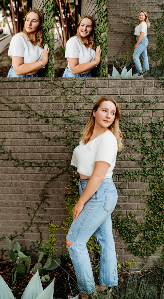 Teenage girl in jeans and a white shirt next to a brick wall on South Congress. 