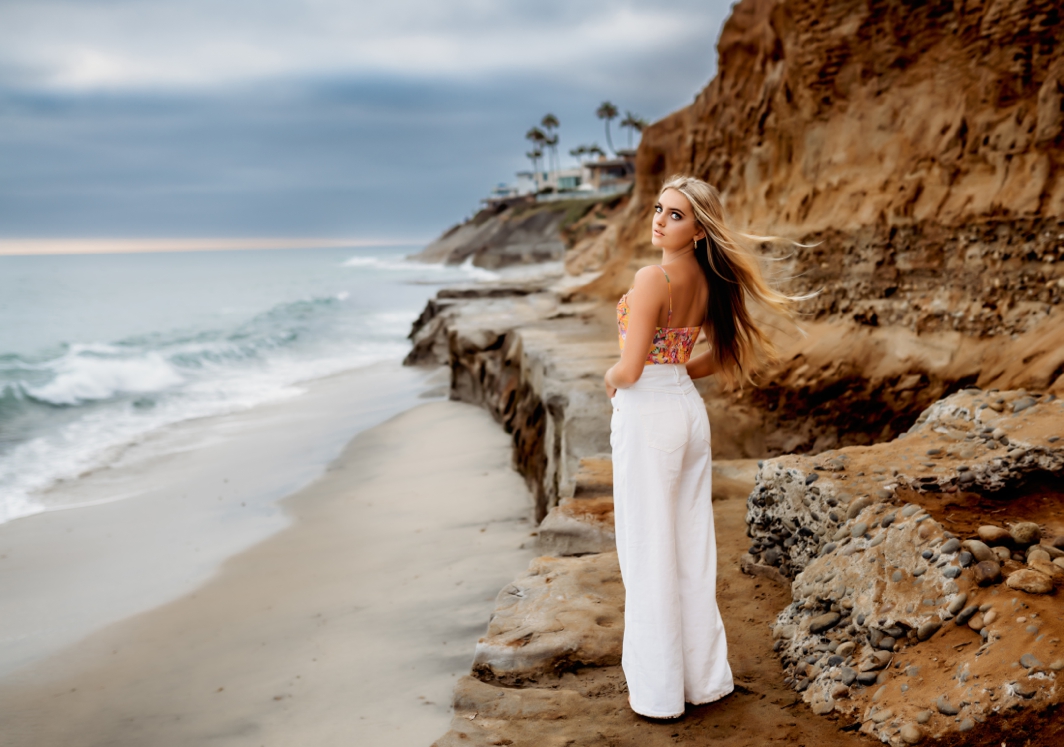 Girl with hair blowing in the wind on an overcast day in San Diego by Jessica Rockowitz Photography.